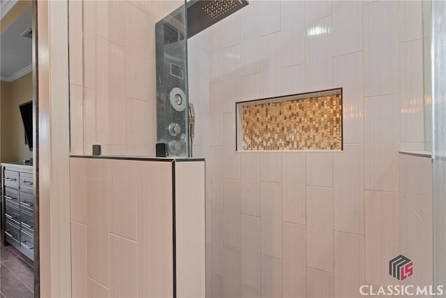 details with ornamental molding and a tile shower