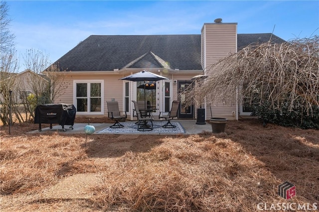 back of property with a patio area