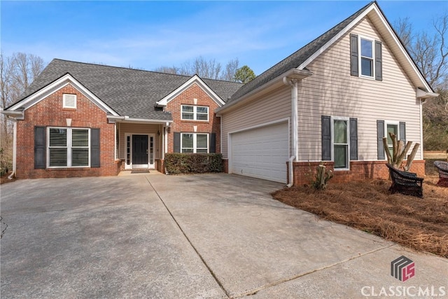 front of property with a garage