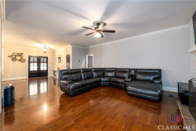 living room featuring crown molding, dark hardwood / wood-style floors, and french doors