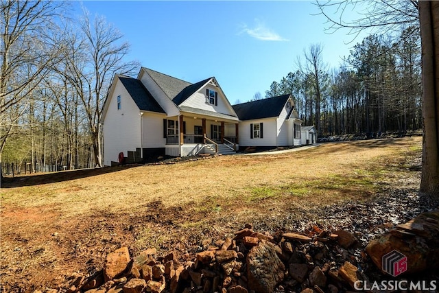 view of front of house featuring a front yard and a porch