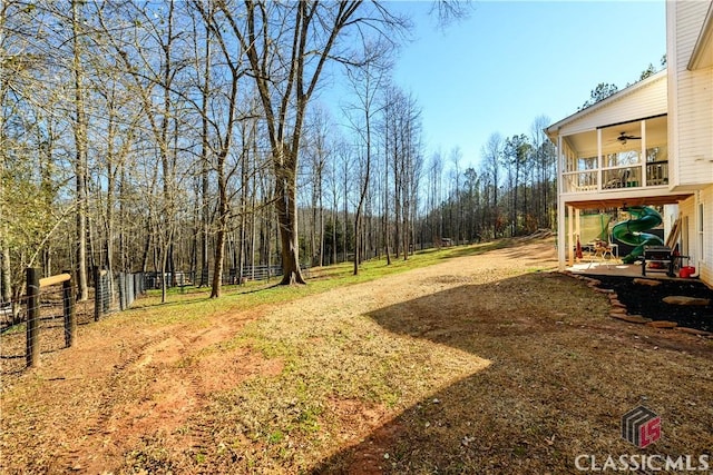 view of yard with ceiling fan