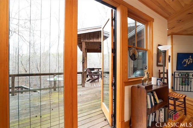 doorway with wooden ceiling and wood finished floors