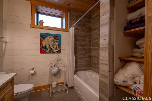 bathroom featuring toilet, shower / bath combo, vanity, and tile patterned floors
