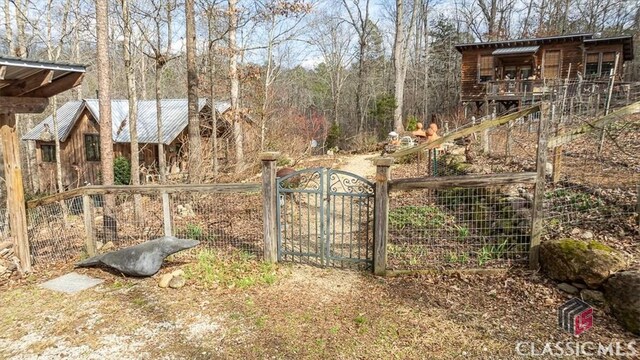 view of gate with fence