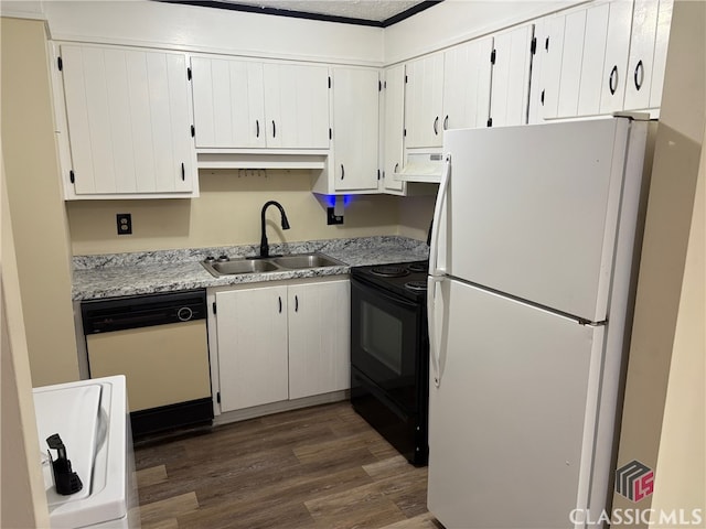 kitchen with white appliances, sink, and white cabinets