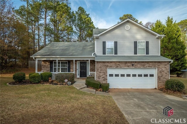 split level home with a garage and a front yard