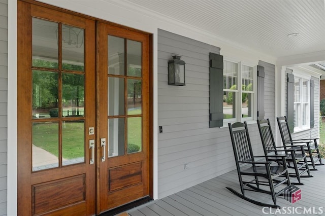 doorway to property featuring french doors and a porch