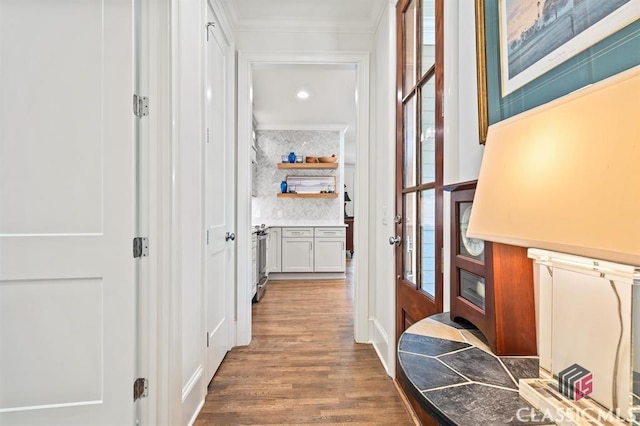 hall featuring crown molding and hardwood / wood-style floors