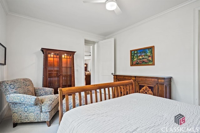 bedroom with ceiling fan, ornamental molding, and carpet