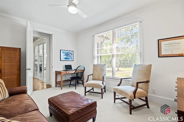 sitting room featuring crown molding, ceiling fan, and light colored carpet