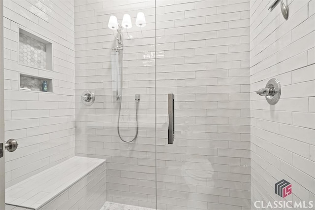 bathroom featuring tiled shower