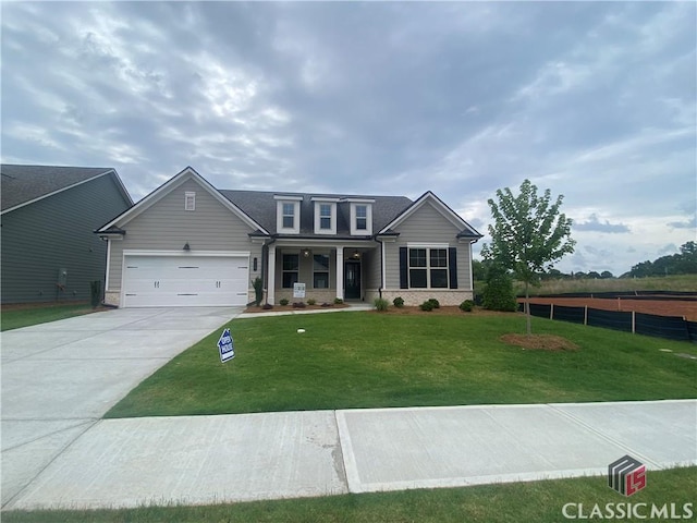 216 Montview Dr, Jefferson, GA 30549 - view of front of property featuring driveway, a garage, and a porch