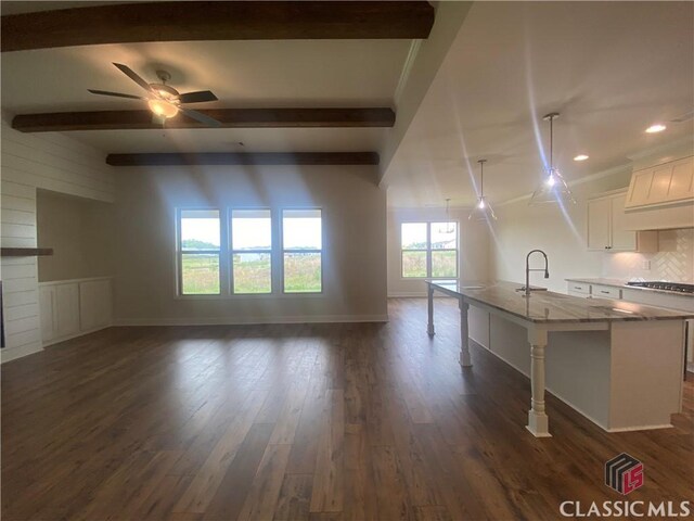 216 Montview Dr, Jefferson, GA 30549 - unfurnished living room featuring beam ceiling, baseboards, a ceiling fan, dark wood-style flooring, and recessed lighting