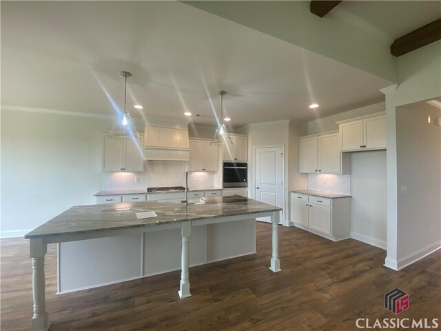 216 Montview Dr, Jefferson, GA 30549 - kitchen featuring white cabinets, baseboards, recessed lighting, tasteful backsplash, and dark stone counters