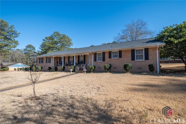 single story home with crawl space, covered porch, and brick siding