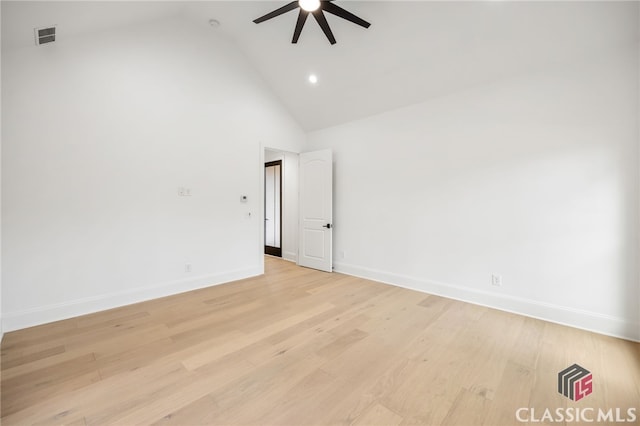 spare room featuring high vaulted ceiling, light hardwood / wood-style flooring, and ceiling fan