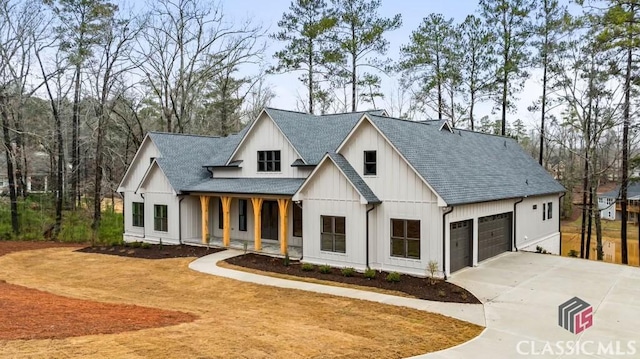 modern farmhouse style home featuring a garage and a porch