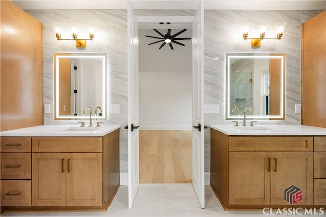 bathroom with ceiling fan and vanity