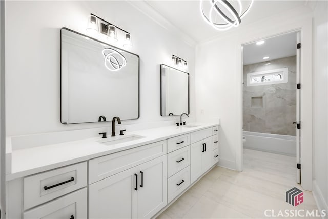 full bathroom with crown molding, vanity, toilet, and tiled shower / bath