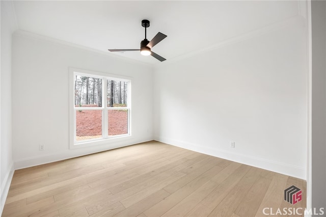 empty room featuring ceiling fan, ornamental molding, and light hardwood / wood-style flooring