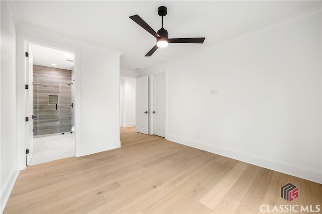 unfurnished bedroom featuring ensuite bathroom, ceiling fan, light hardwood / wood-style flooring, and crown molding