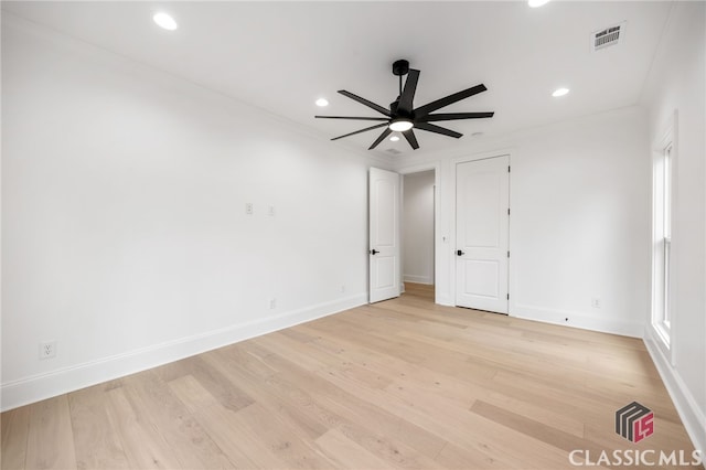 unfurnished bedroom with light wood-type flooring and ornamental molding