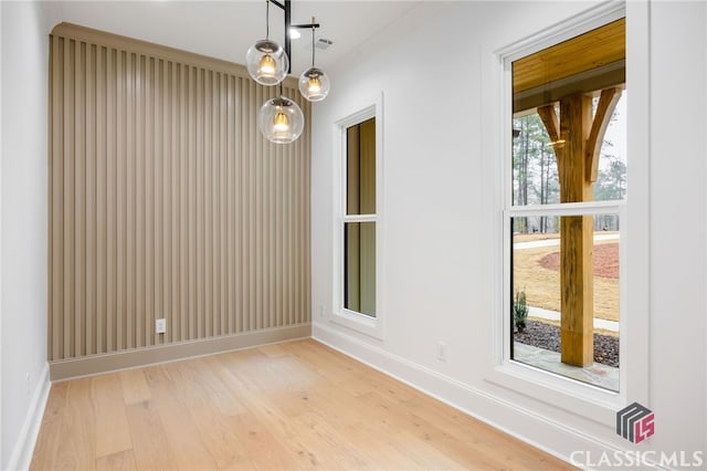 unfurnished room featuring light hardwood / wood-style flooring