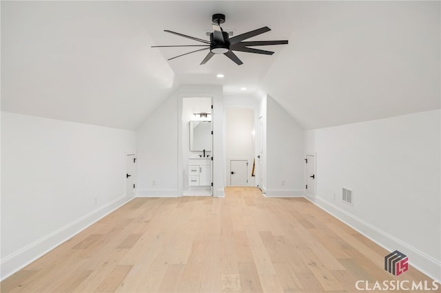 additional living space featuring ceiling fan, light hardwood / wood-style floors, and lofted ceiling