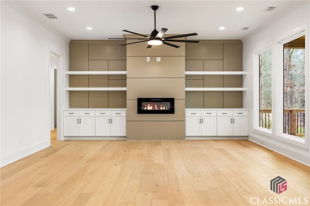 unfurnished living room featuring light hardwood / wood-style floors and ceiling fan