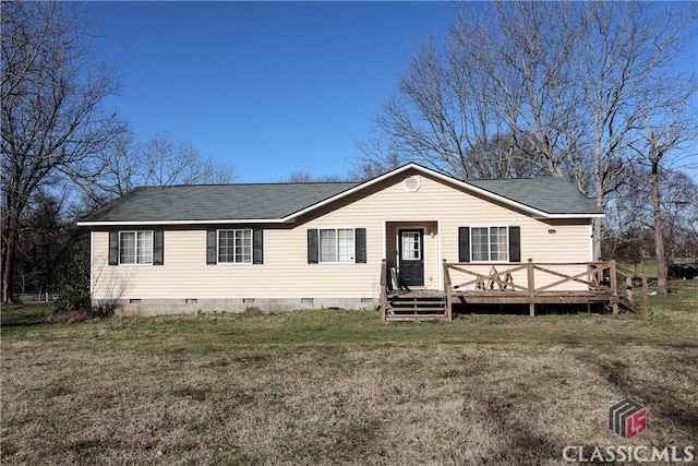 view of front of property with a front lawn and a wooden deck