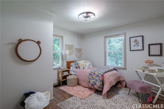 bedroom with hardwood / wood-style floors