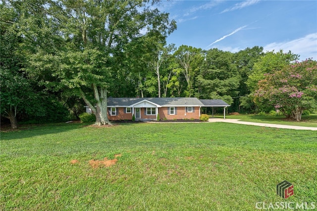 ranch-style house with a front lawn and a carport