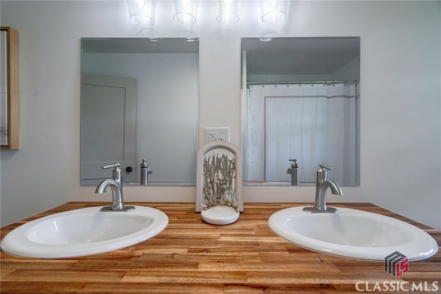 bathroom with vanity and walk in shower