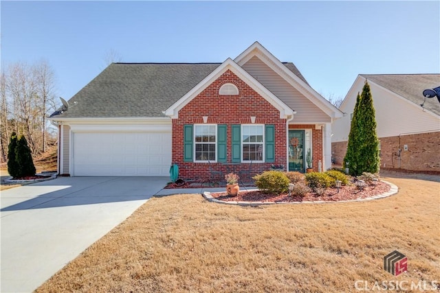 view of front of home with a garage, driveway, brick siding, and a front yard