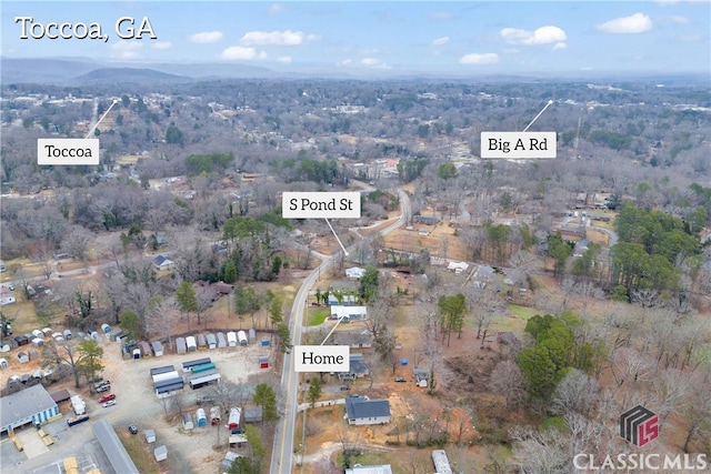 drone / aerial view featuring a mountain view