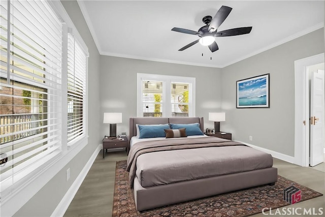 bedroom with ornamental molding, a ceiling fan, baseboards, and wood finished floors