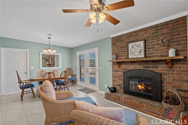 living area with light tile patterned floors, french doors, a brick fireplace, and visible vents