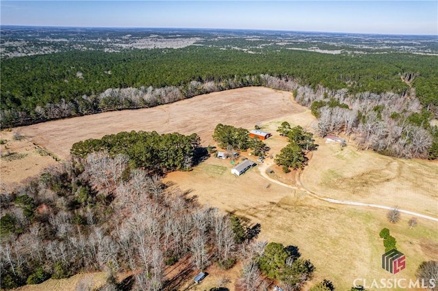 drone / aerial view featuring a view of trees