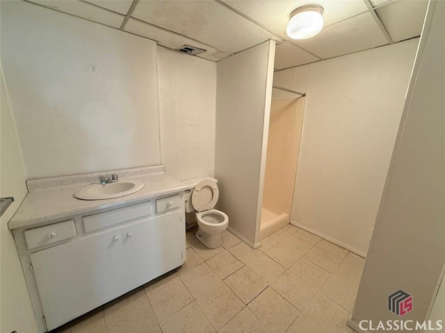 full bathroom with a drop ceiling, toilet, a shower stall, and visible vents