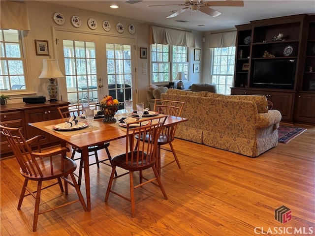 dining area with light wood-type flooring, ceiling fan, recessed lighting, and french doors