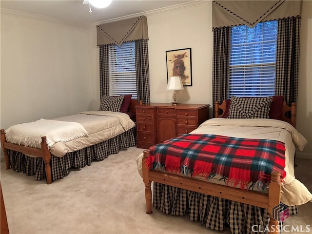 bedroom featuring carpet floors and crown molding