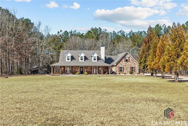 view of front of property featuring stone siding and a front lawn