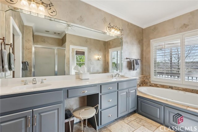 bathroom with double vanity, ornamental molding, a sink, a shower stall, and a bath