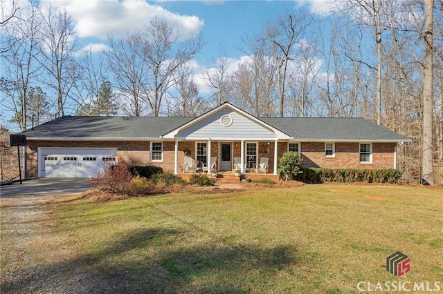 view of front of property with concrete driveway, brick siding, and a front lawn