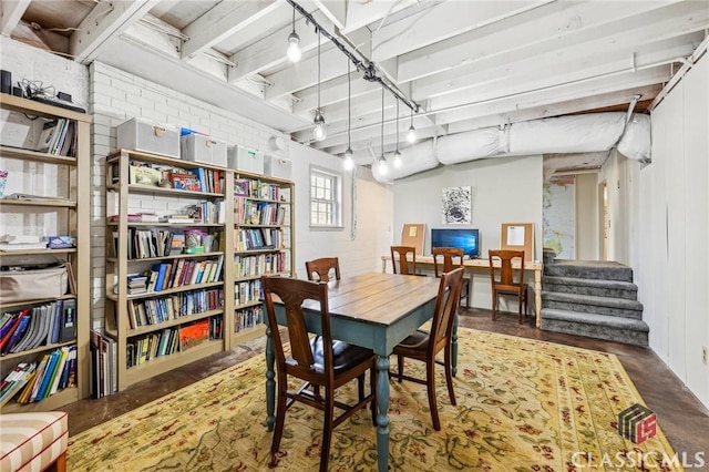 dining room featuring stairs