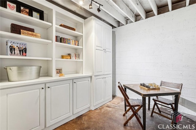 dining room with concrete floors