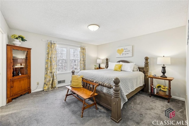 bedroom with baseboards, carpet, visible vents, and a textured ceiling