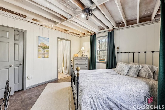 bedroom featuring concrete floors