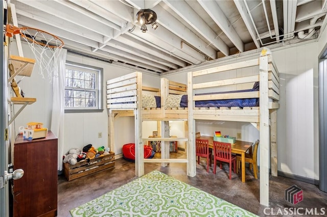 bedroom featuring unfinished concrete flooring